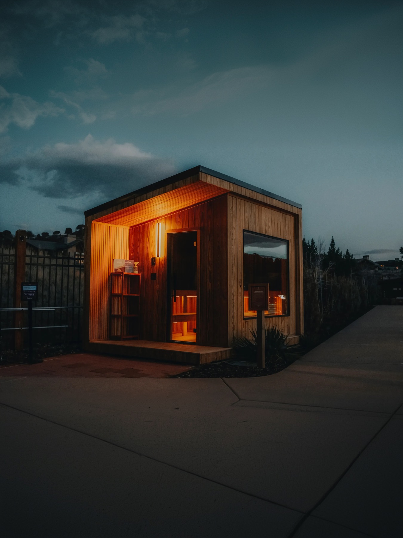 212 Designer exterior glowing warm at dusk under a blue sky