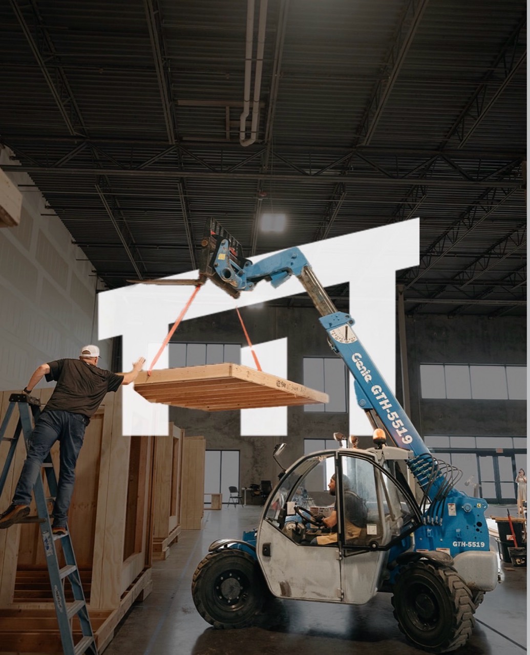 A roof frame being lifted into place in the workshop, with a white graphic overlaid on the photograph