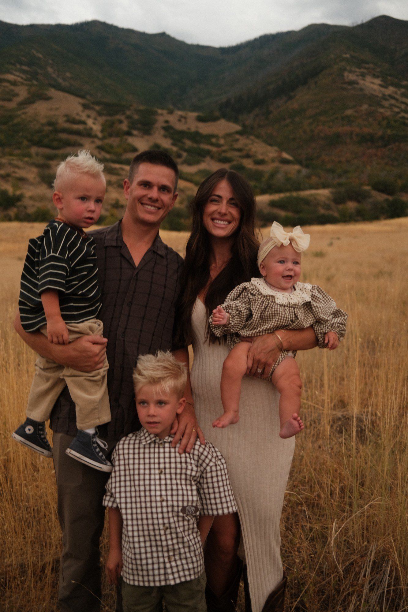 Cole with his wife and three children in the foothills