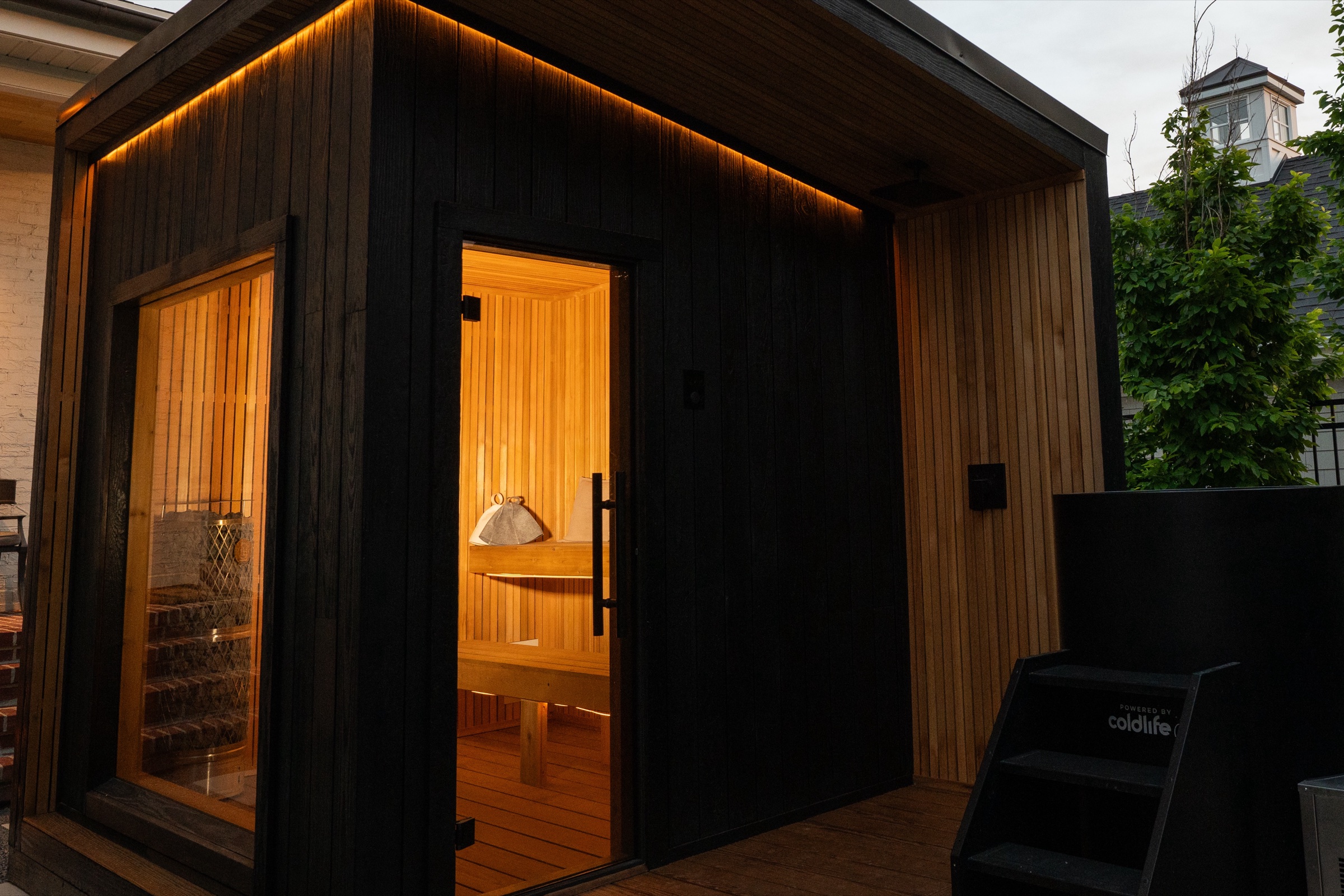 Charred 212 Designer glowing beneath its deep roof overhang