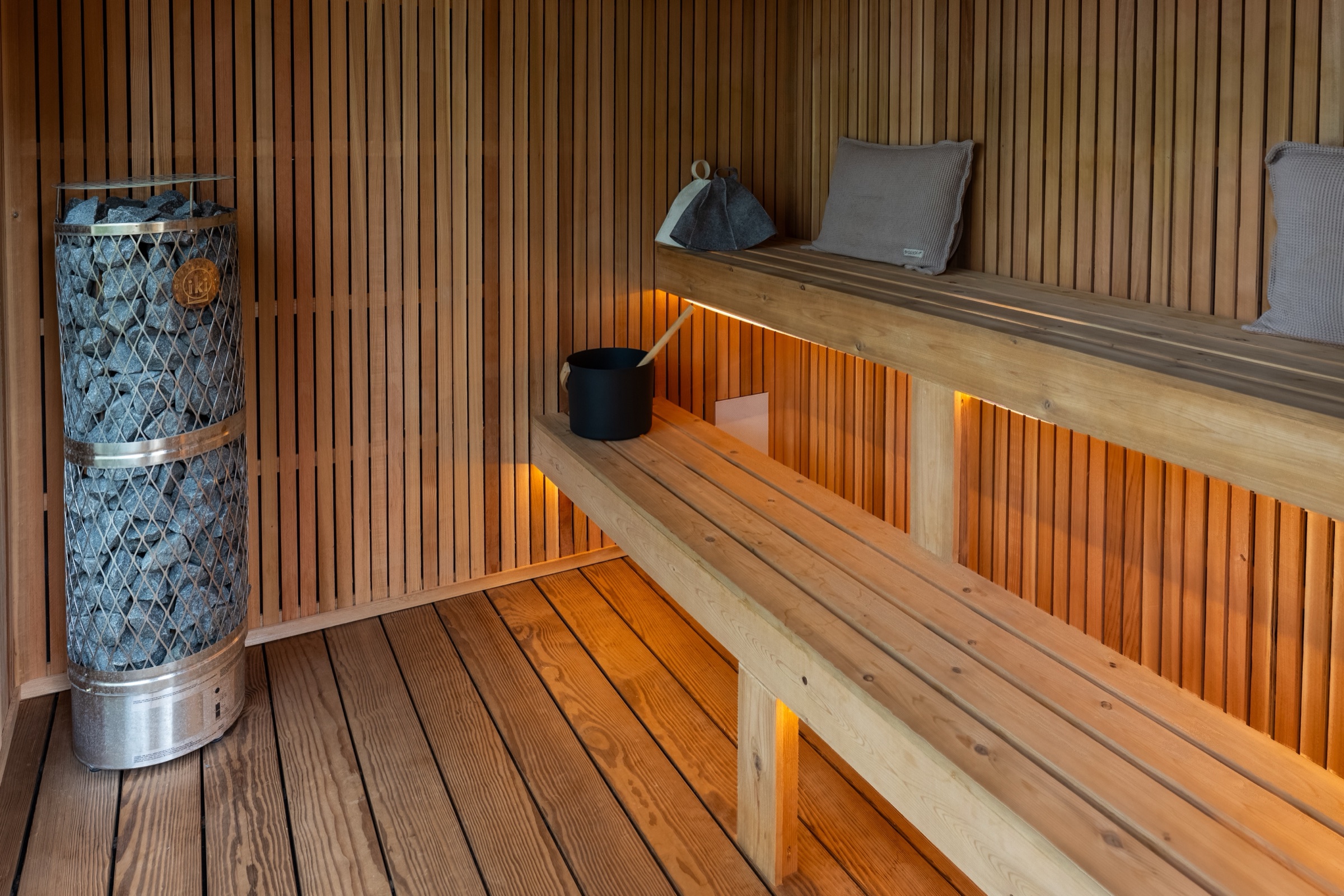 IKI heater and two-tier Western Red Cedar benches inside the 212 Designer