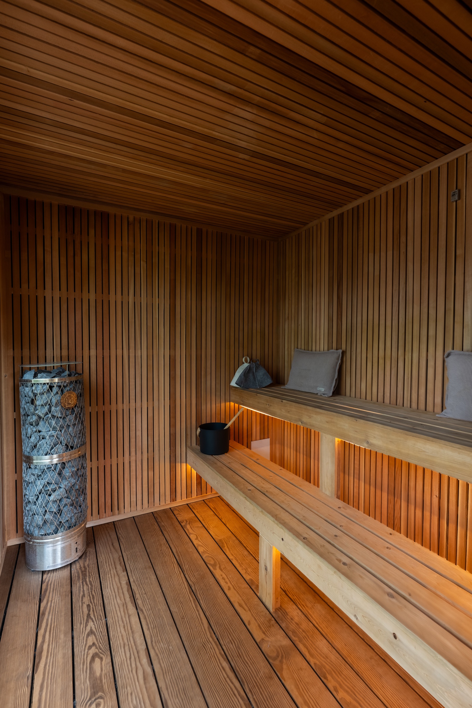 IKI heater and two-tier Western Red Cedar benches inside the 212 Designer