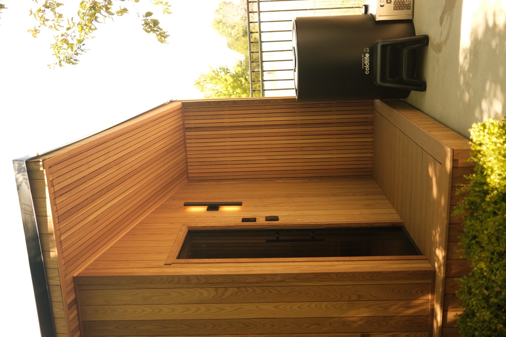 Covered porch and hidden-hinge glass door on a cedar 212 Designer