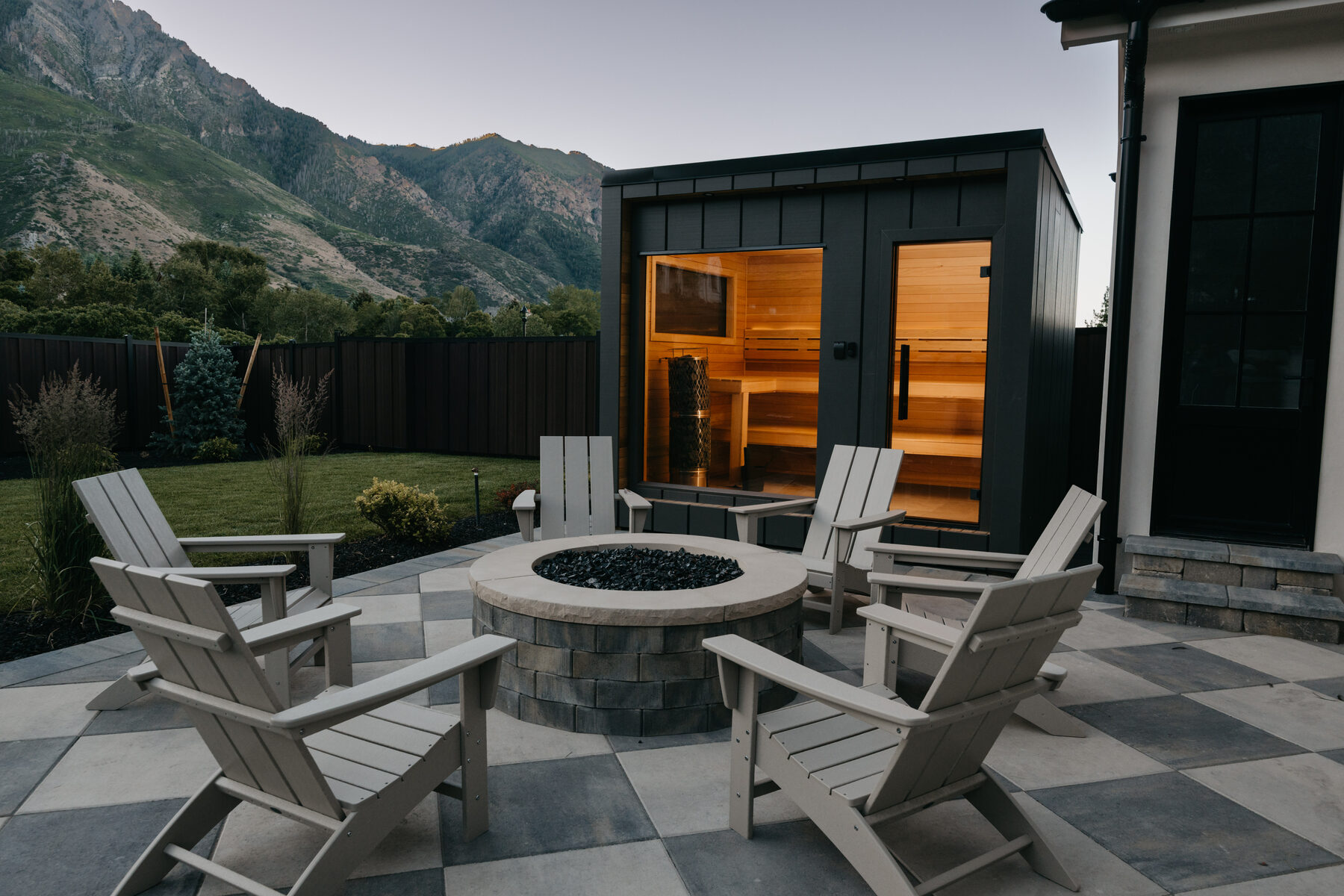 212 Essential sauna with fire pit patio and mountain backdrop