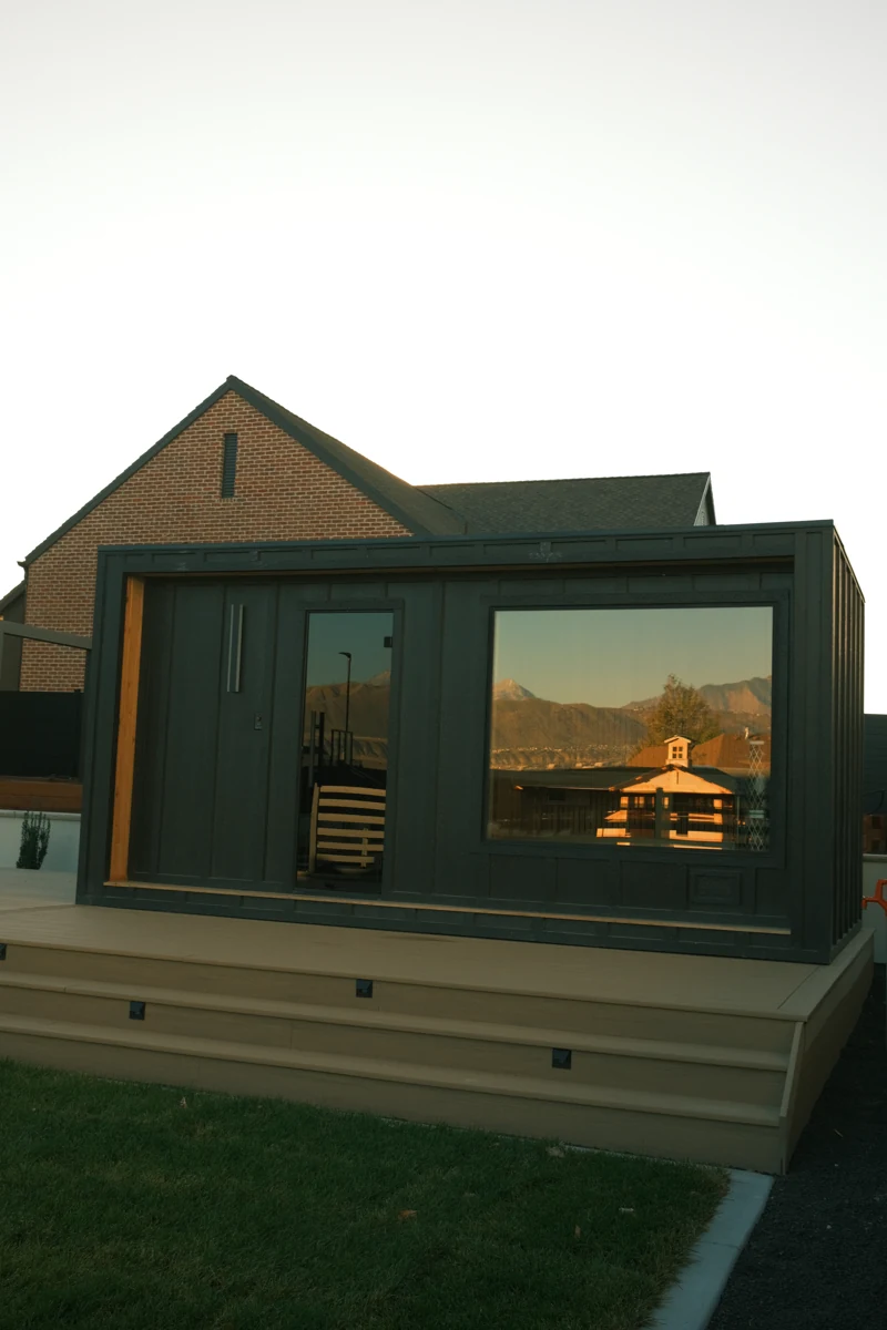 Full front of the Thermal Suite Essential with glass door and large sauna window