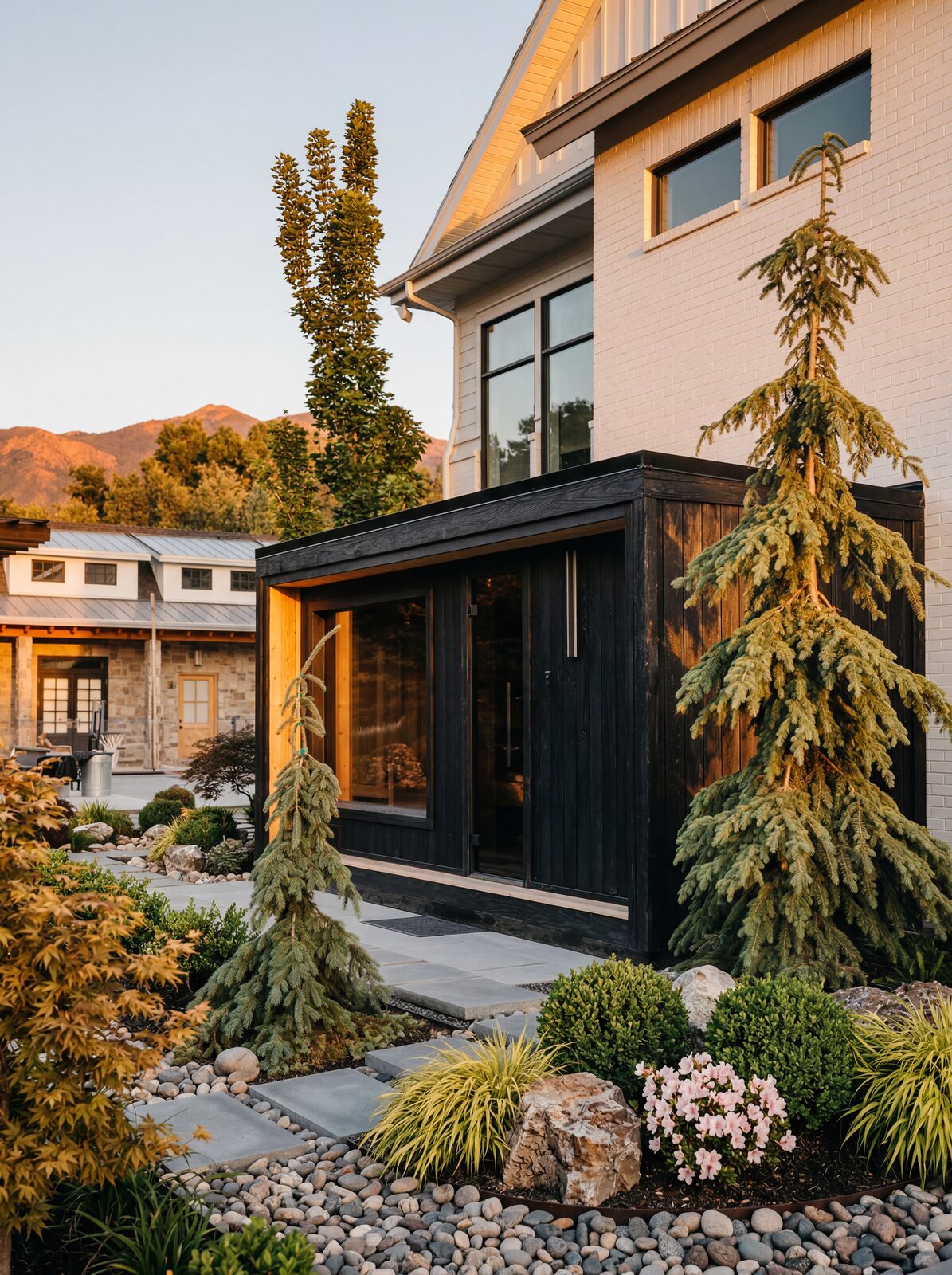 Thermal Suite Essential, charred cladding among evergreens