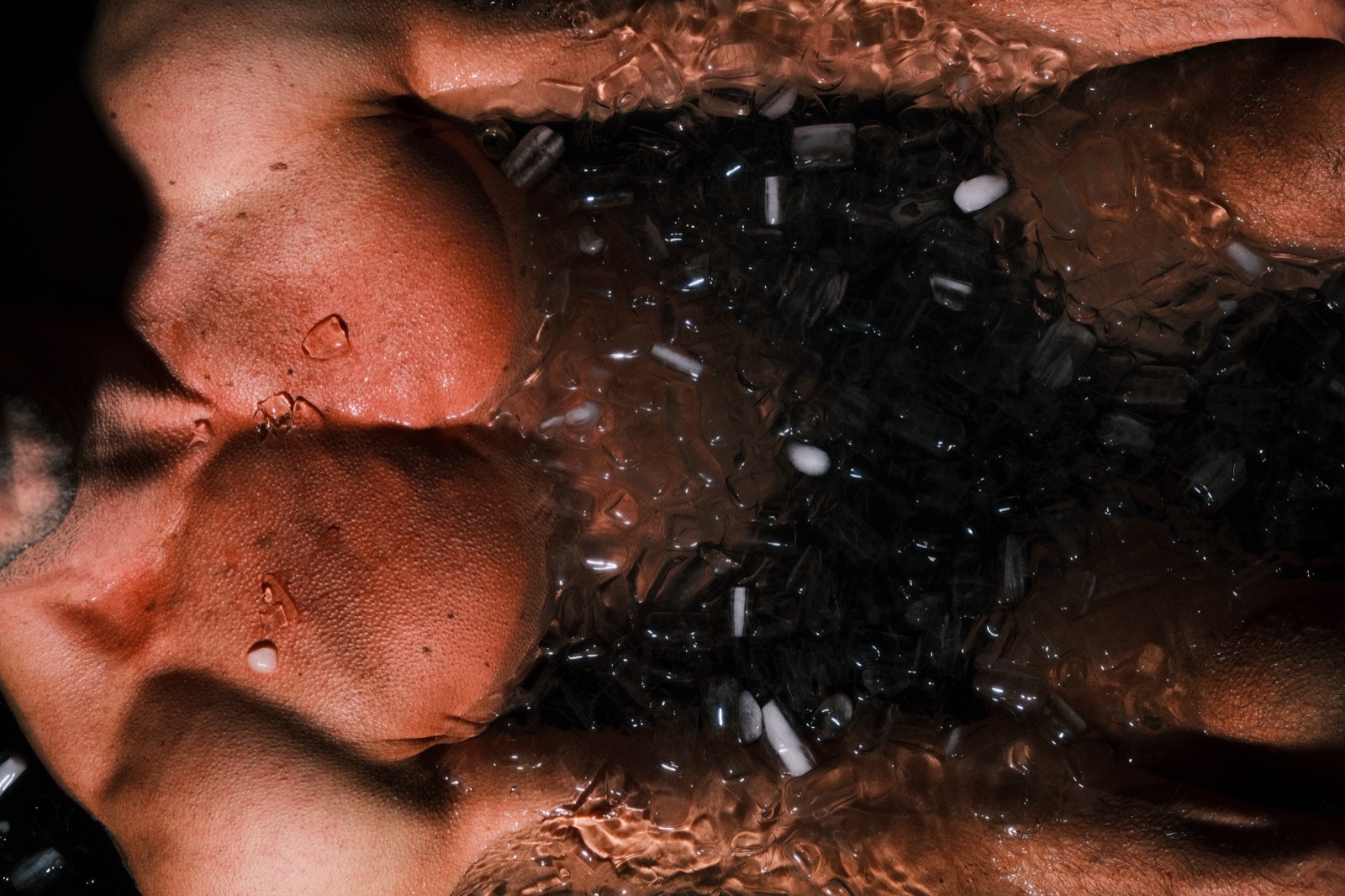 An athlete submerged to the chest in an ice bath