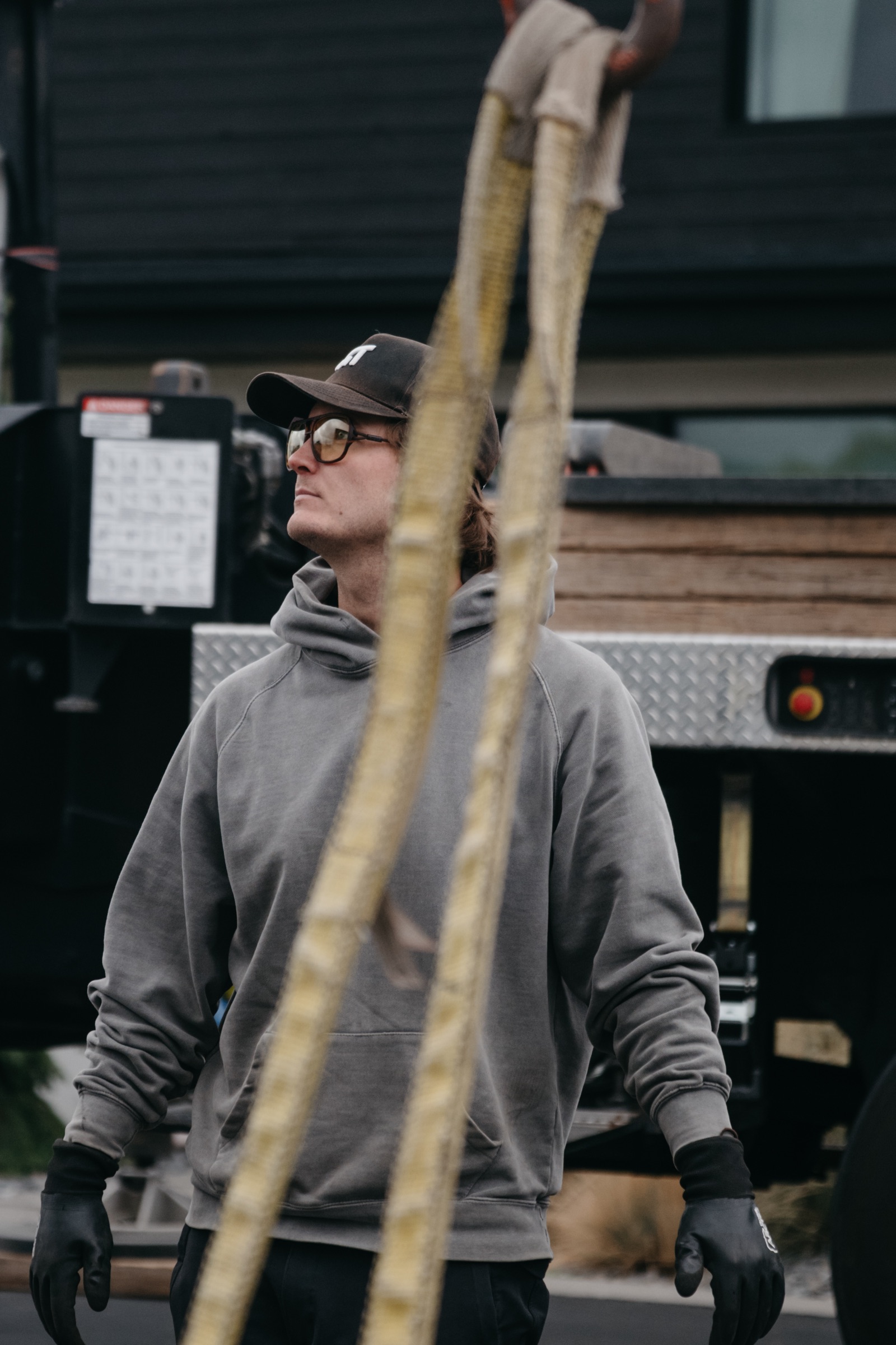 Crew member carrying lifting straps to the sauna