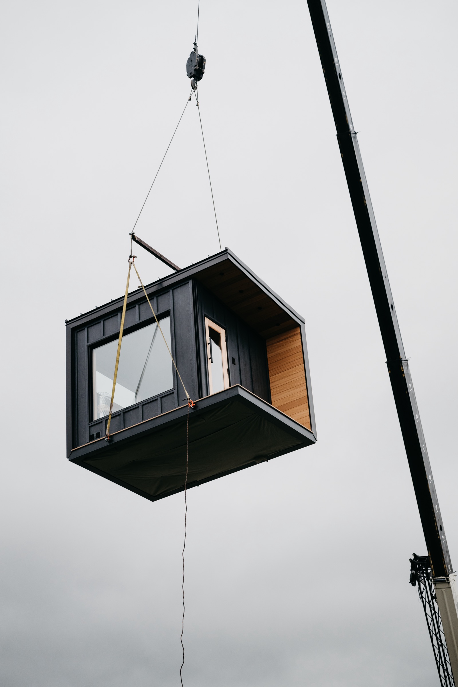 Cedar soffit and window seen from below during the lift