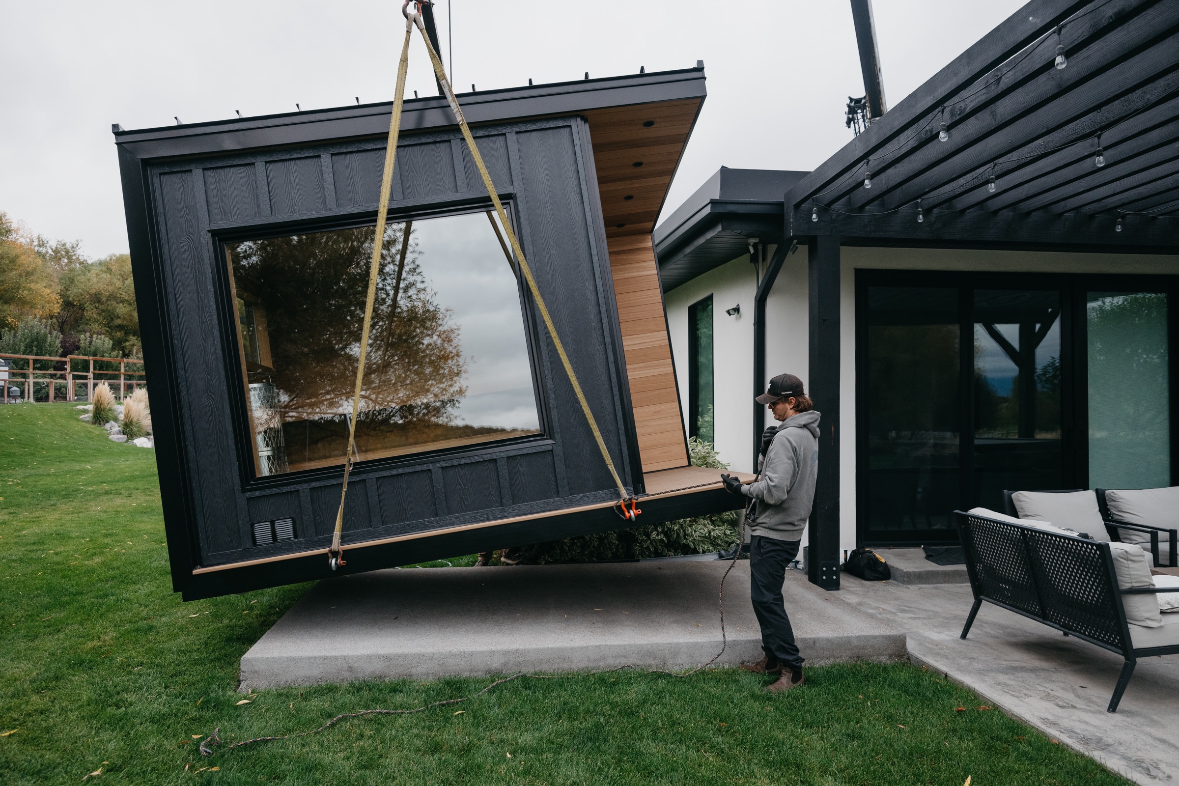 The 212 Designer setting down on the concrete pad beside the patio