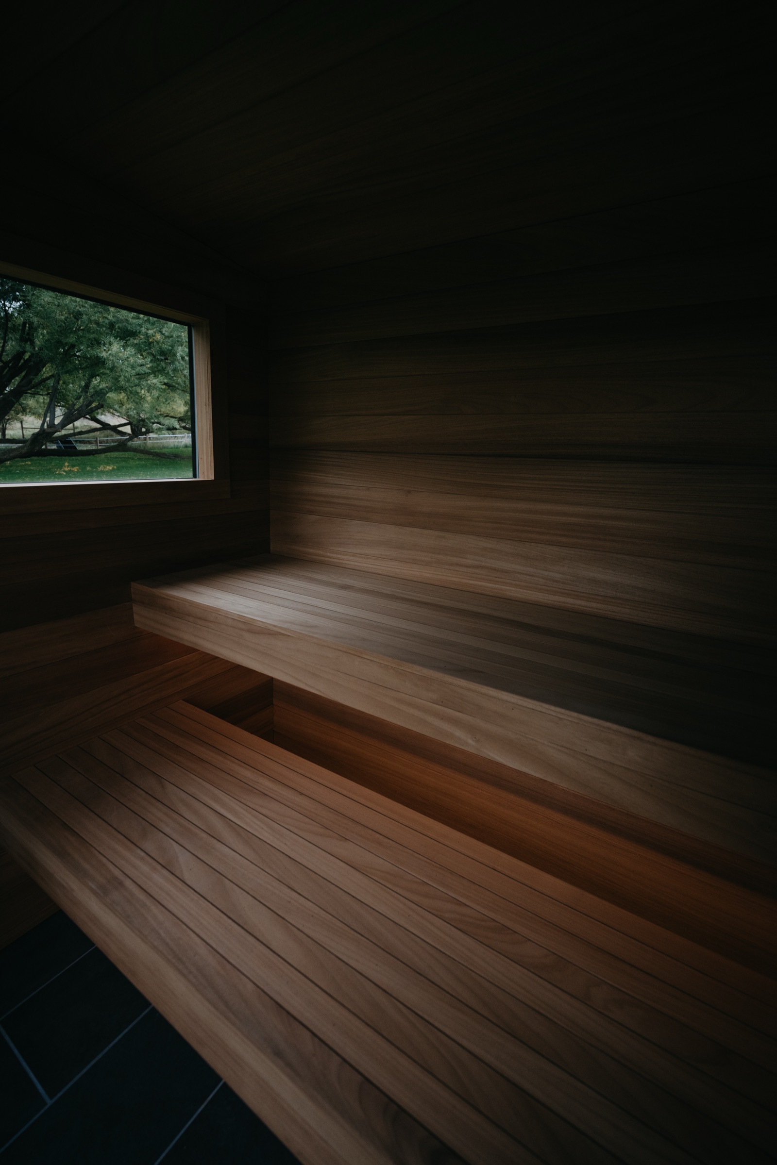 Tiered cedar benches inside the sauna