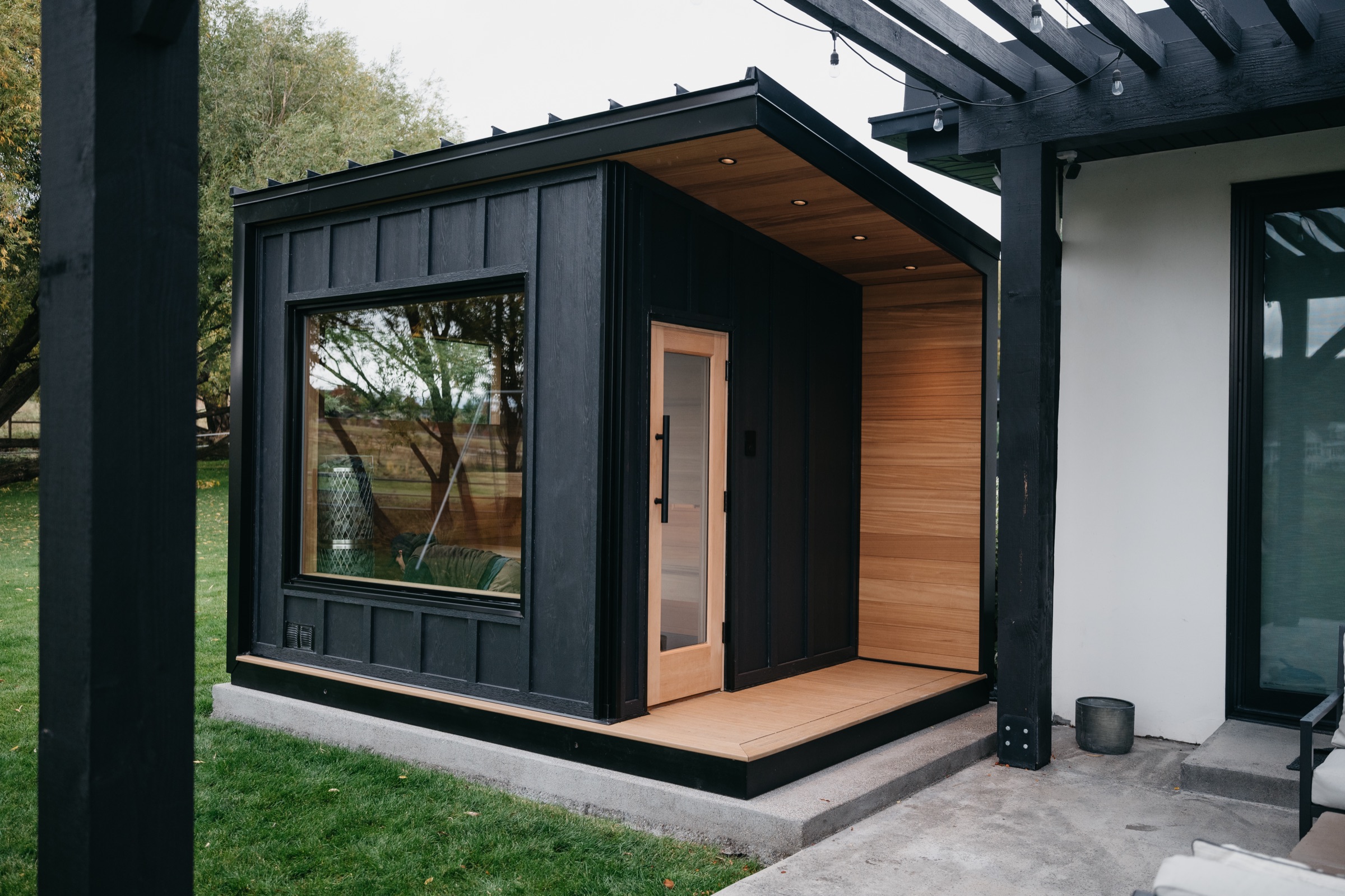 The finished 212 Designer beside the home's patio