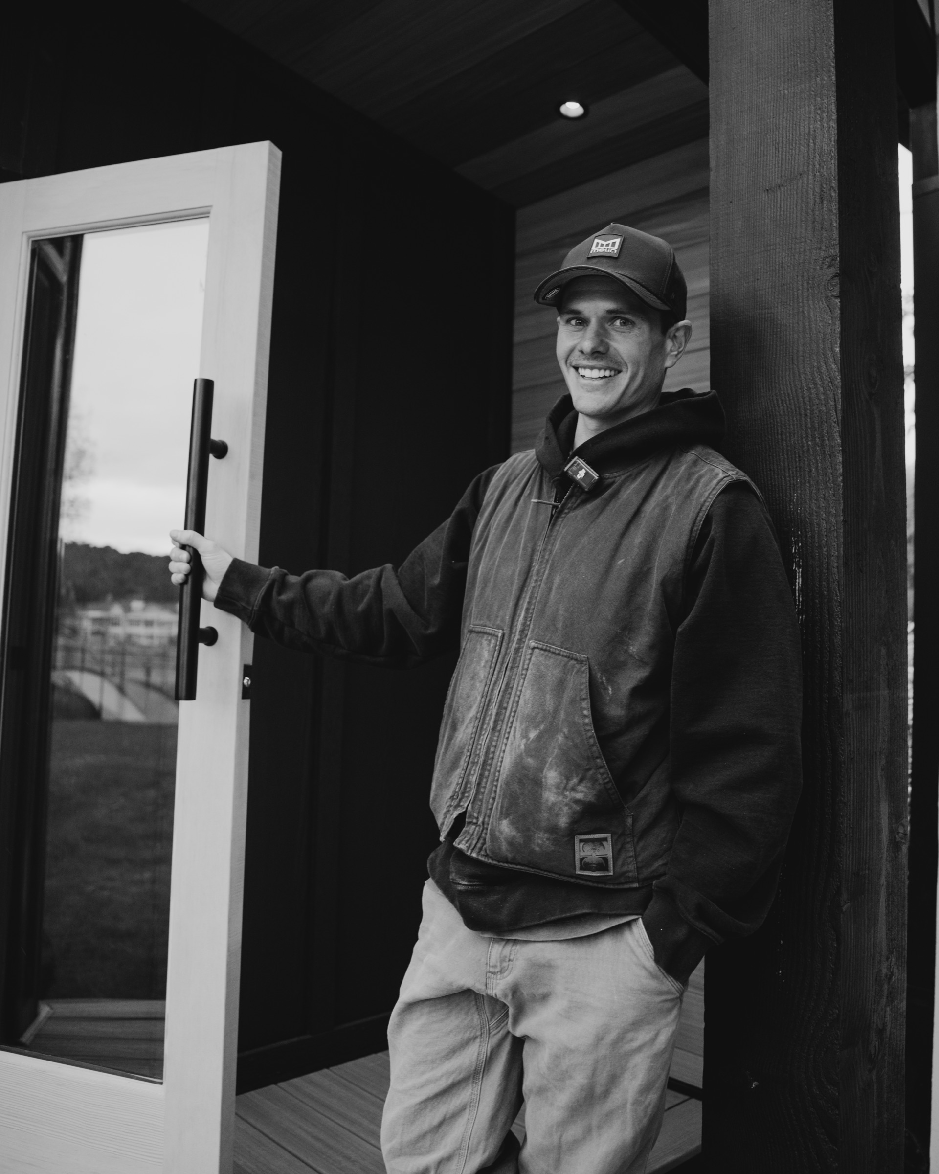 Crew member at the open sauna door