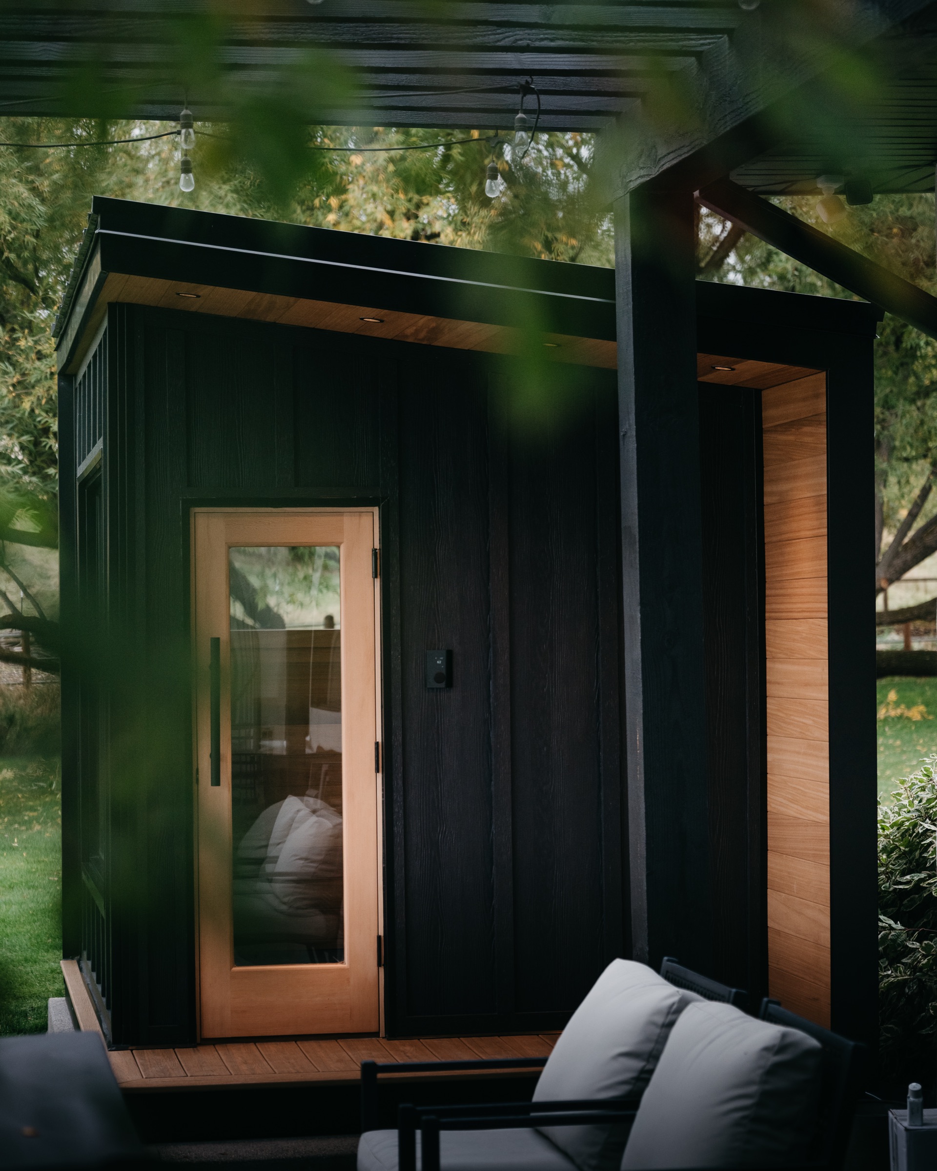 Cedar door with the patio seating in front